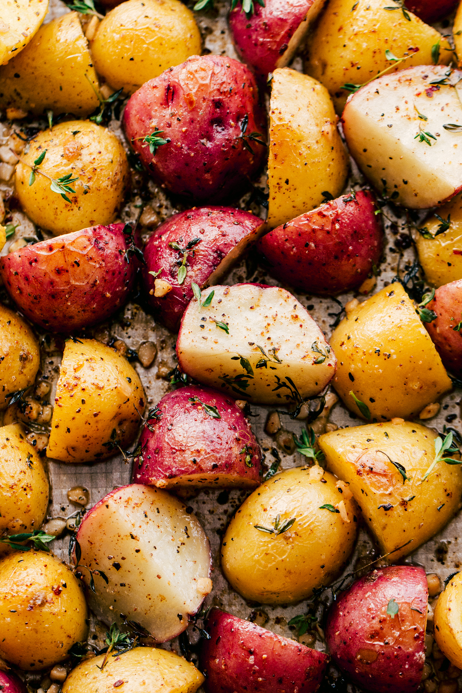 Roasted potatoes in garlic butter topped chopped rosemary by the food cafe. 