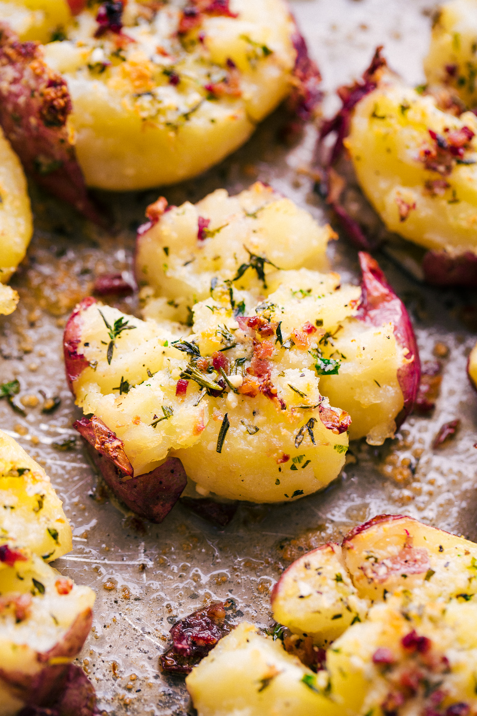 smashed red potatoes on a sheet pan delicious and bursting with flavor, by The Food Cafe