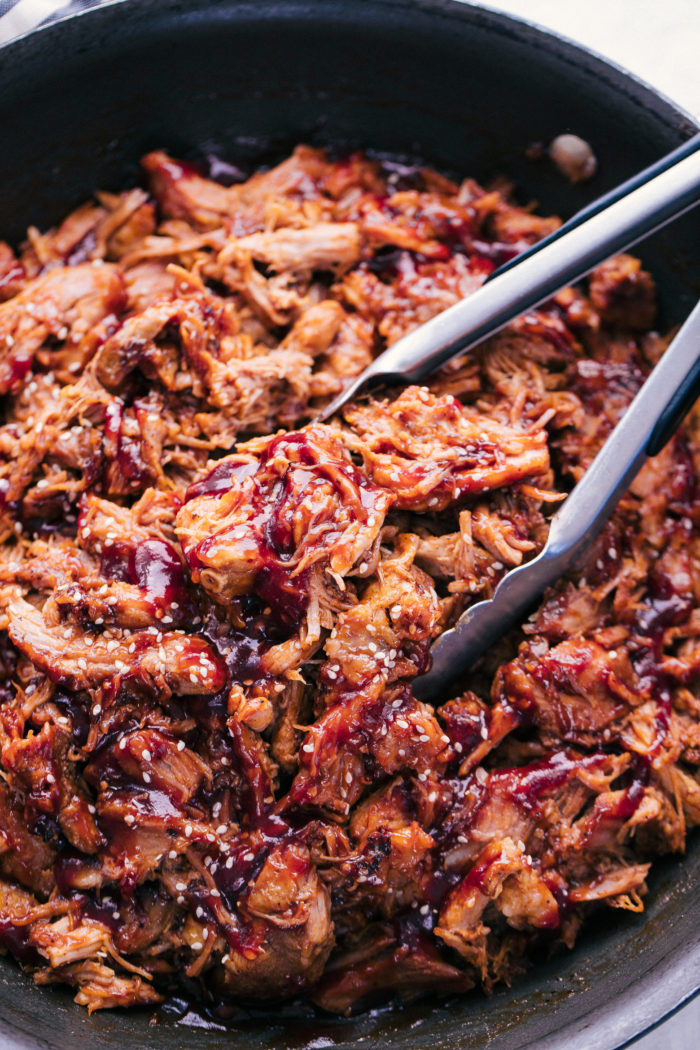 Pulled Pork smothered with BBQ sauce in a skillet by The Food Cafe. 