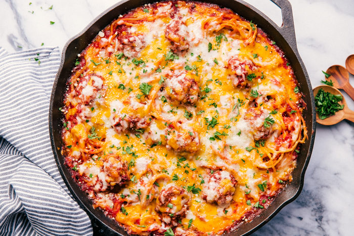 baked spaghetti casserole in a cast iron skillet. perfect 30 minute meal
